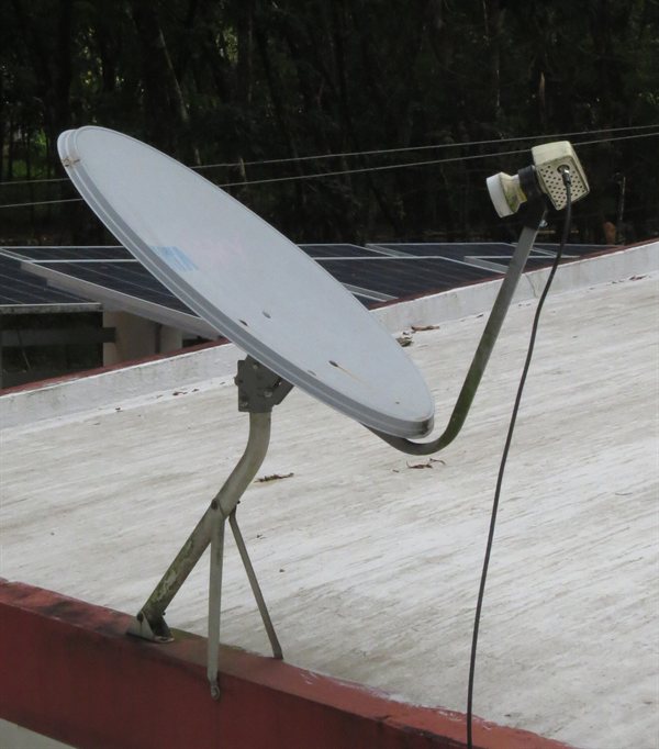 A DTH satellite dish on a building in India